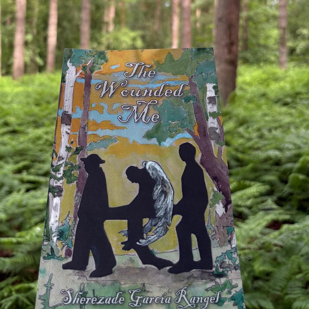 The Wounded Me novel by Sherezade Garcia Rangel in a background of a forest